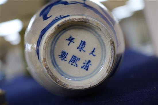 A Chinese blue and white soft paste porcelain vase, 18th century, with a Kangxi mark, 18cm